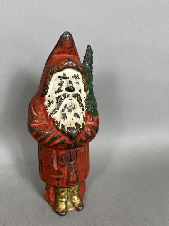 PAINTED CAST IRON SANTA WITH TREE