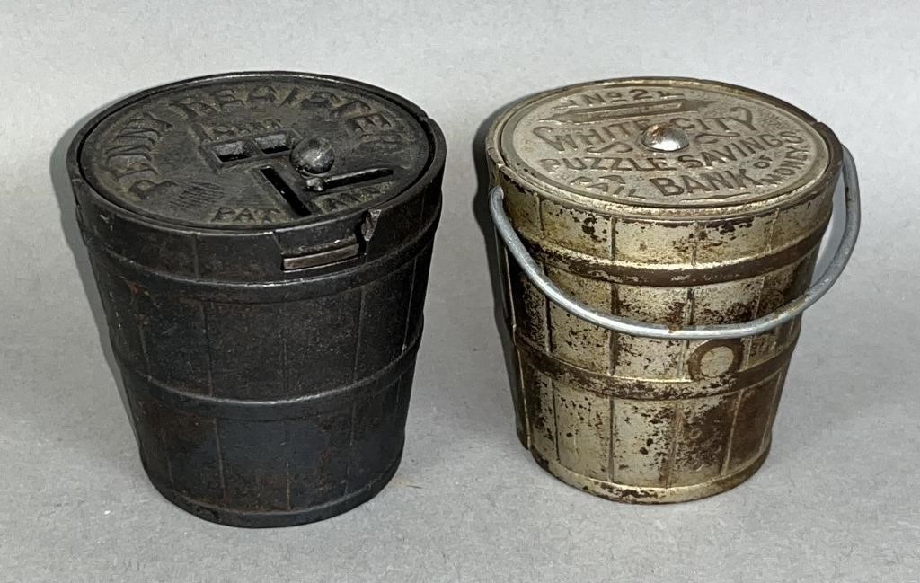 2 CAST IRON BUCKET SHAPED BANKS