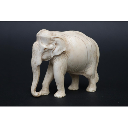 Finely carved ivory figure of an elephant,