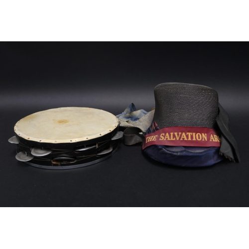 Salvation army bonnet along with a tambourine