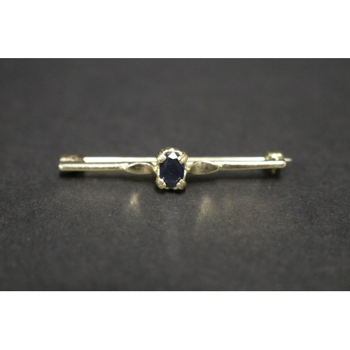 Small silver gilt brooch set with sapphire