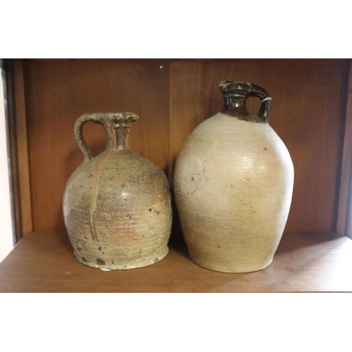 Two antique French stoneware jugs, approx