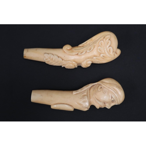 Two well carved ivory handles, one carved