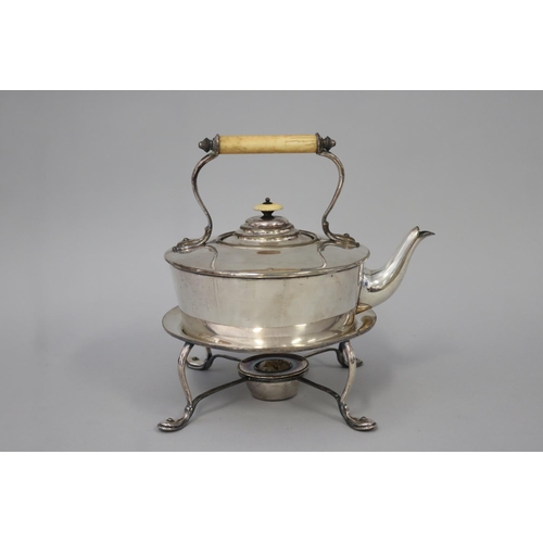 Silver plated teapot on stand,