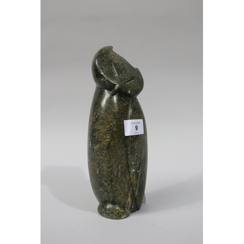 Carved green stone figure of an