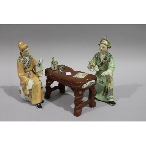 Two Chinese figures with a table, approx
