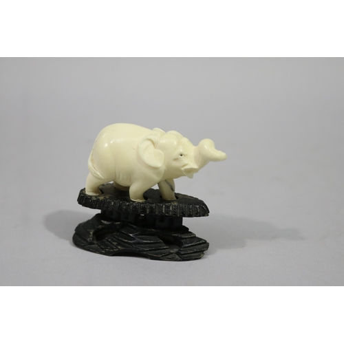 Small carved ivory elephant, wooden
