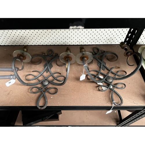 Pair of interlaced iron two light wall
