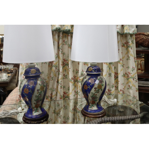 Two ceramic lamps, each approx