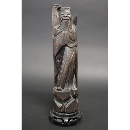 Carved Oriental god figure with