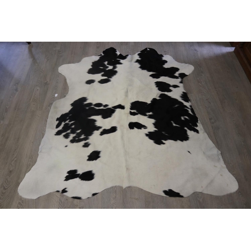 Cow hide floor rug, approx 215cm