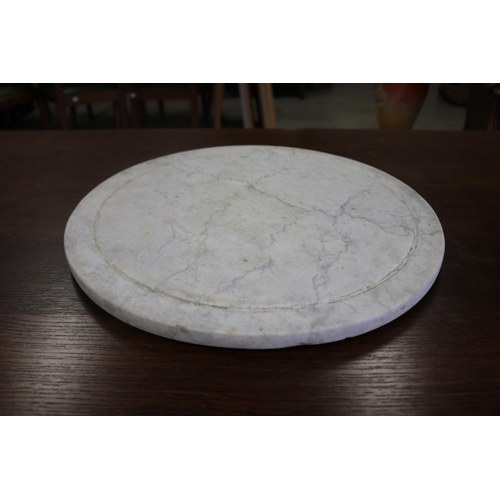 Circular white marble revolving table