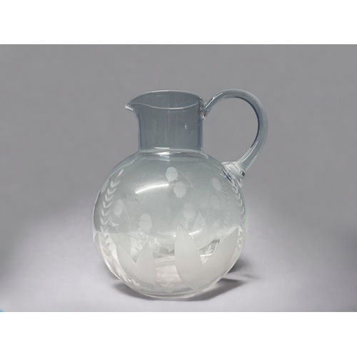 A TIFFANY & CO CRYSTAL WATER PITCHER.Etched