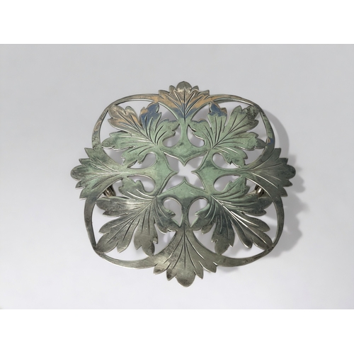 AN UNUSUAL SILVER PLATE FRENCH TRIVET