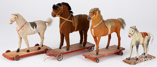 FOUR PLATFORM HORSE PULL TOYS,