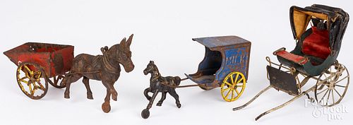 TWO CAST IRON AND TIN HORSE DRAWN