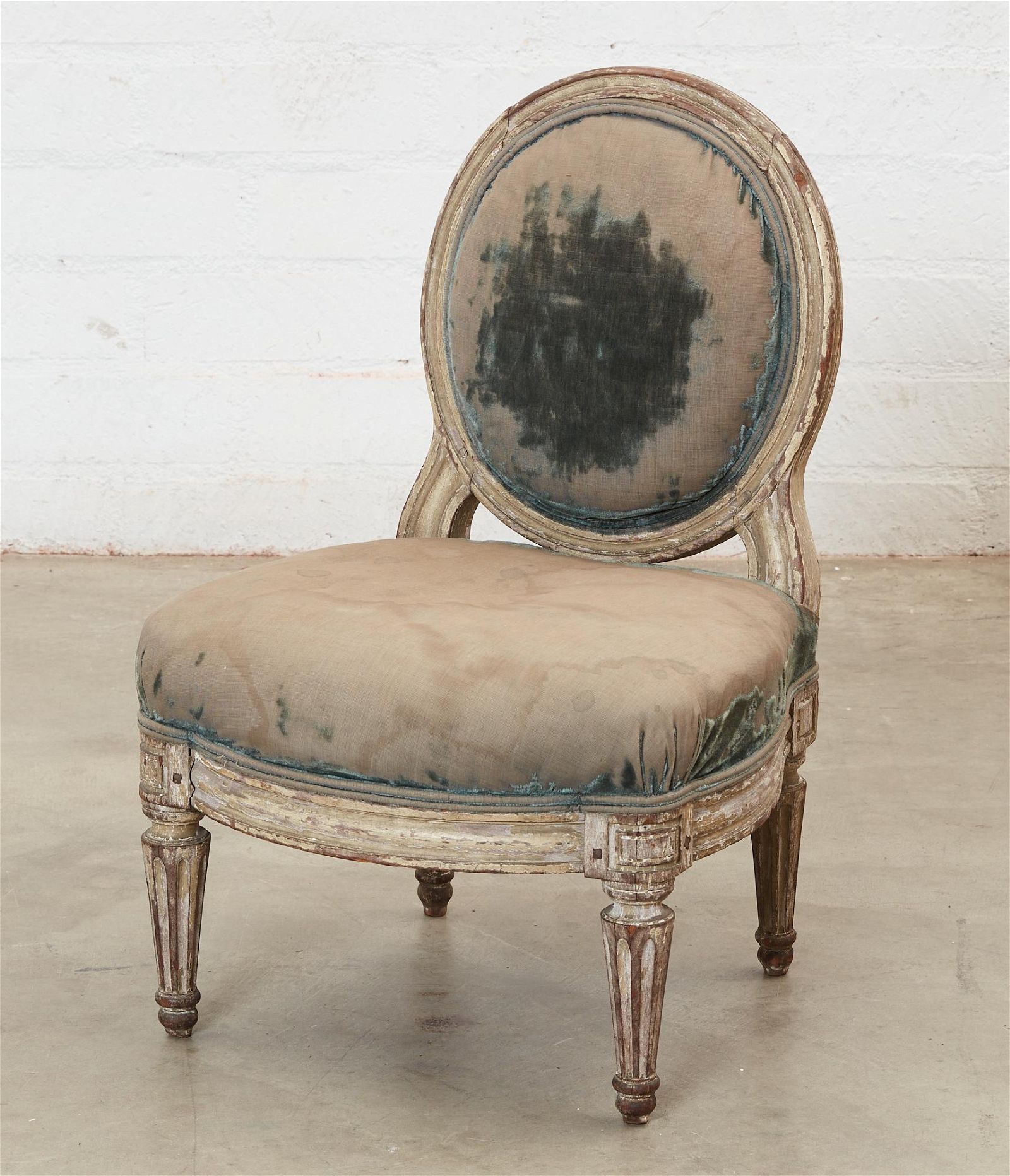 A LOUIS XVI WHITE PAINTED CHAISE