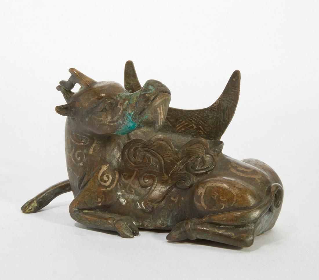 A CHINESE BRONZE MYTHICAL BEAST