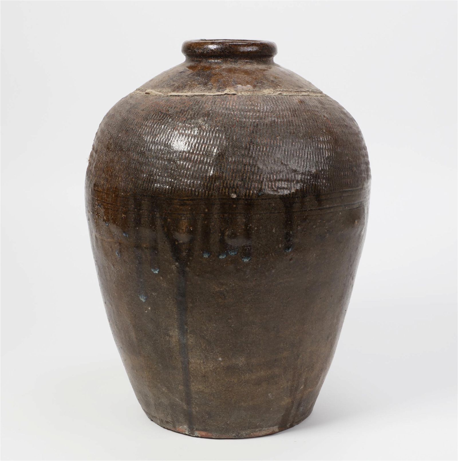 A LARGE GLAZED POTTERY JARA large