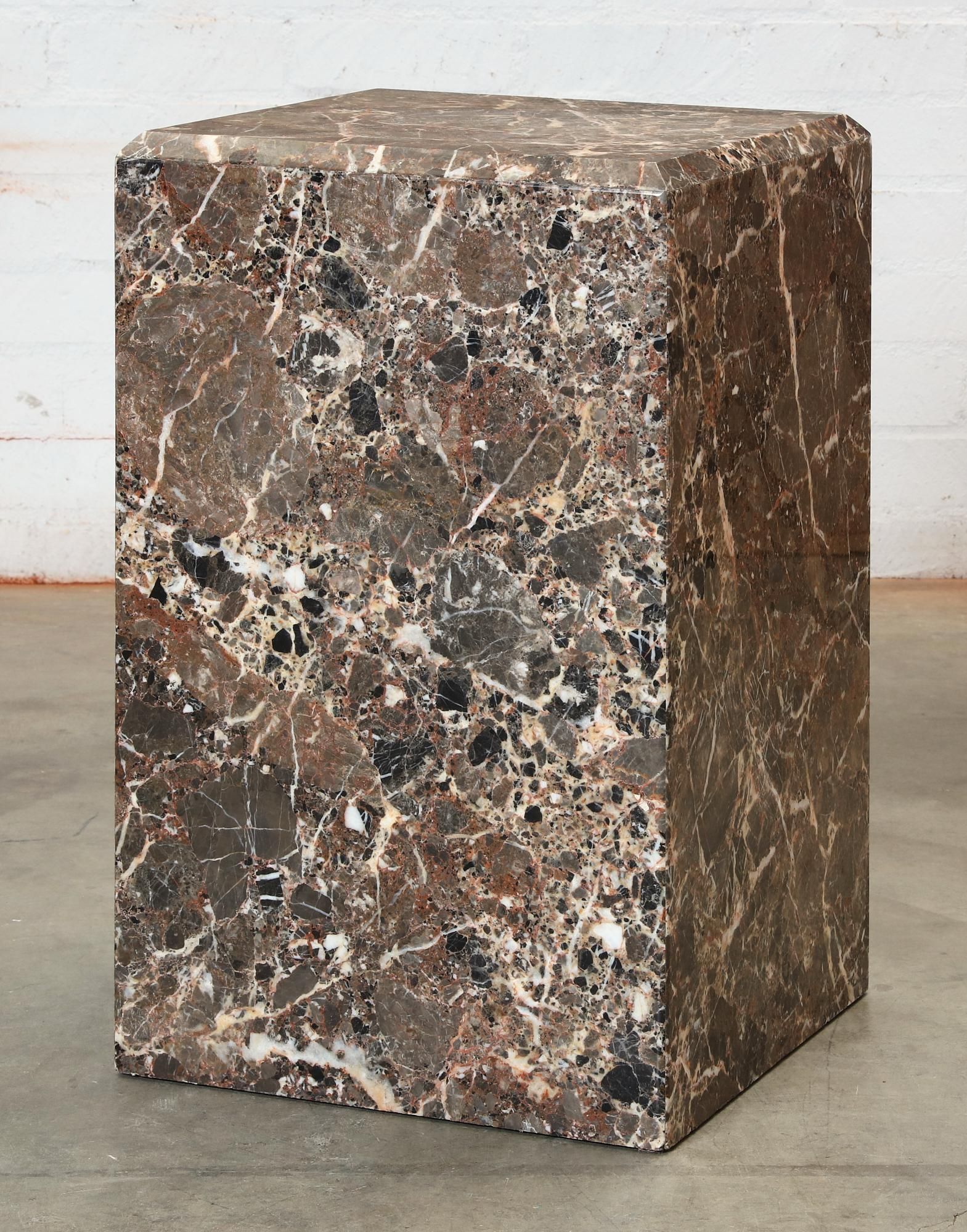 A GREY AND BROWN BRECCIA MARBLE