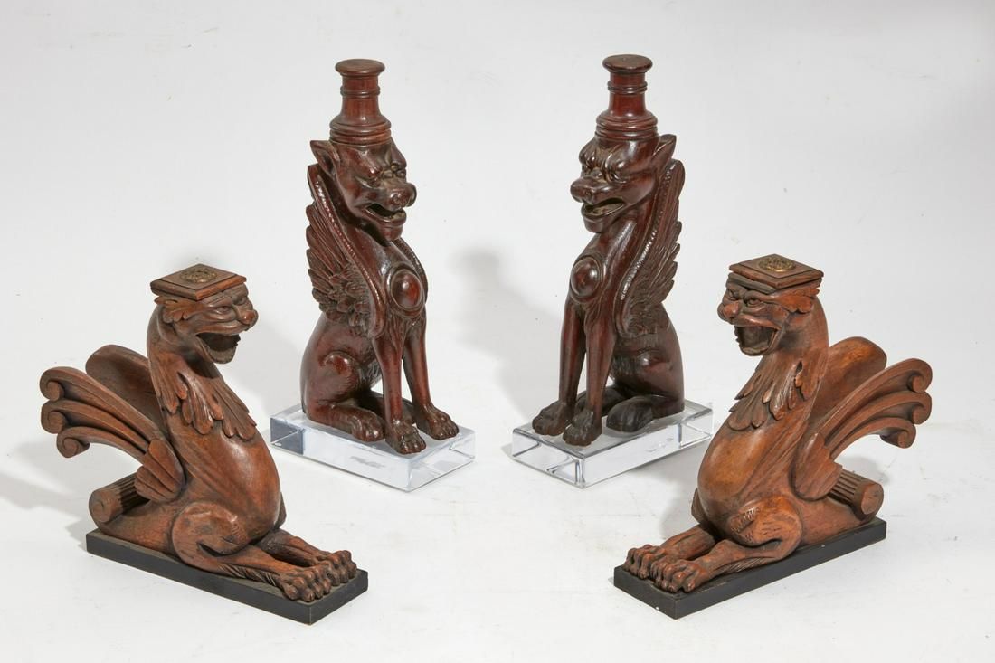 TWO PAIRS OF CARVED WOOD WINGED LIONSTwo