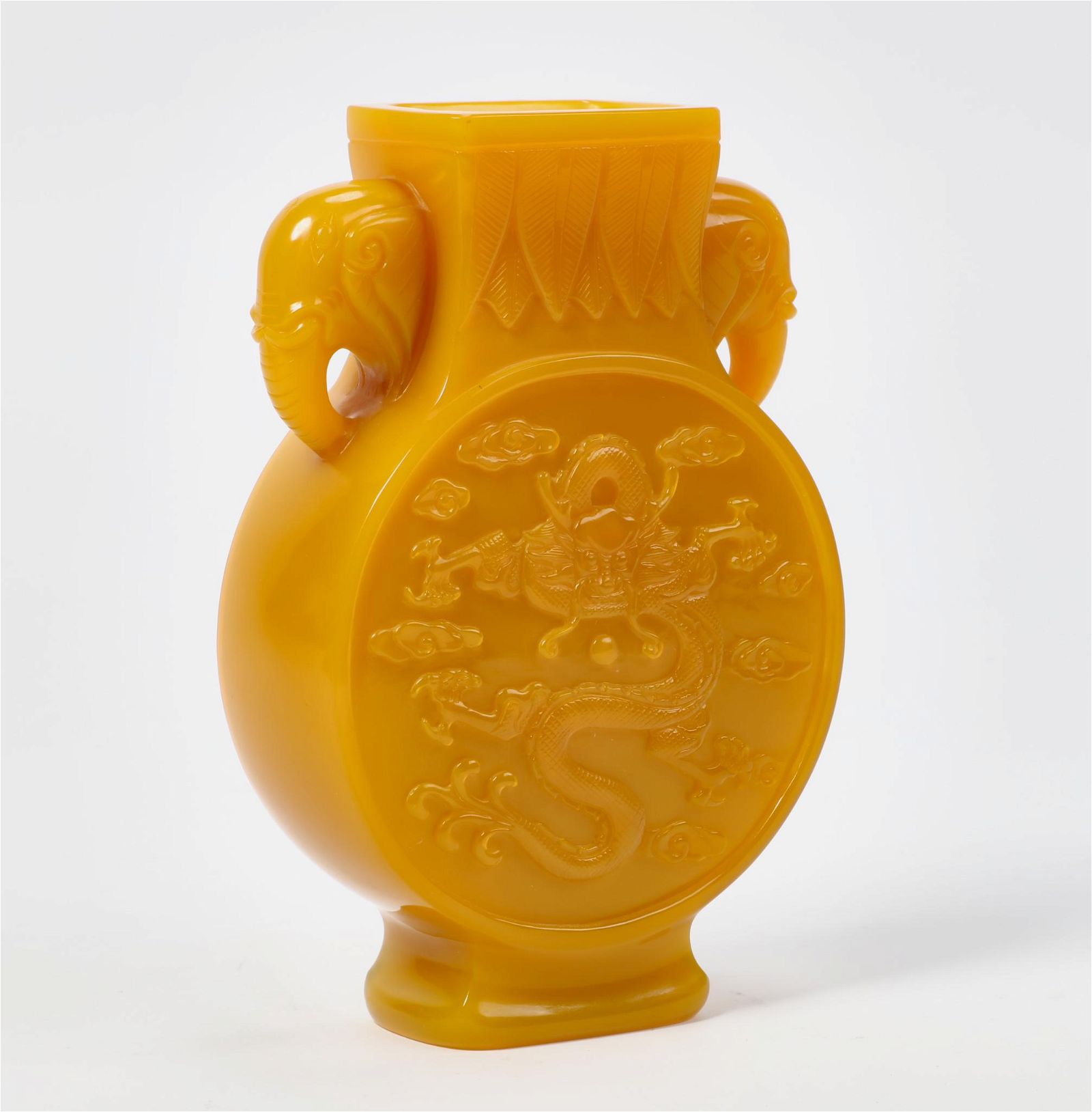 A CHINESE CARVED YELLOW PEKING