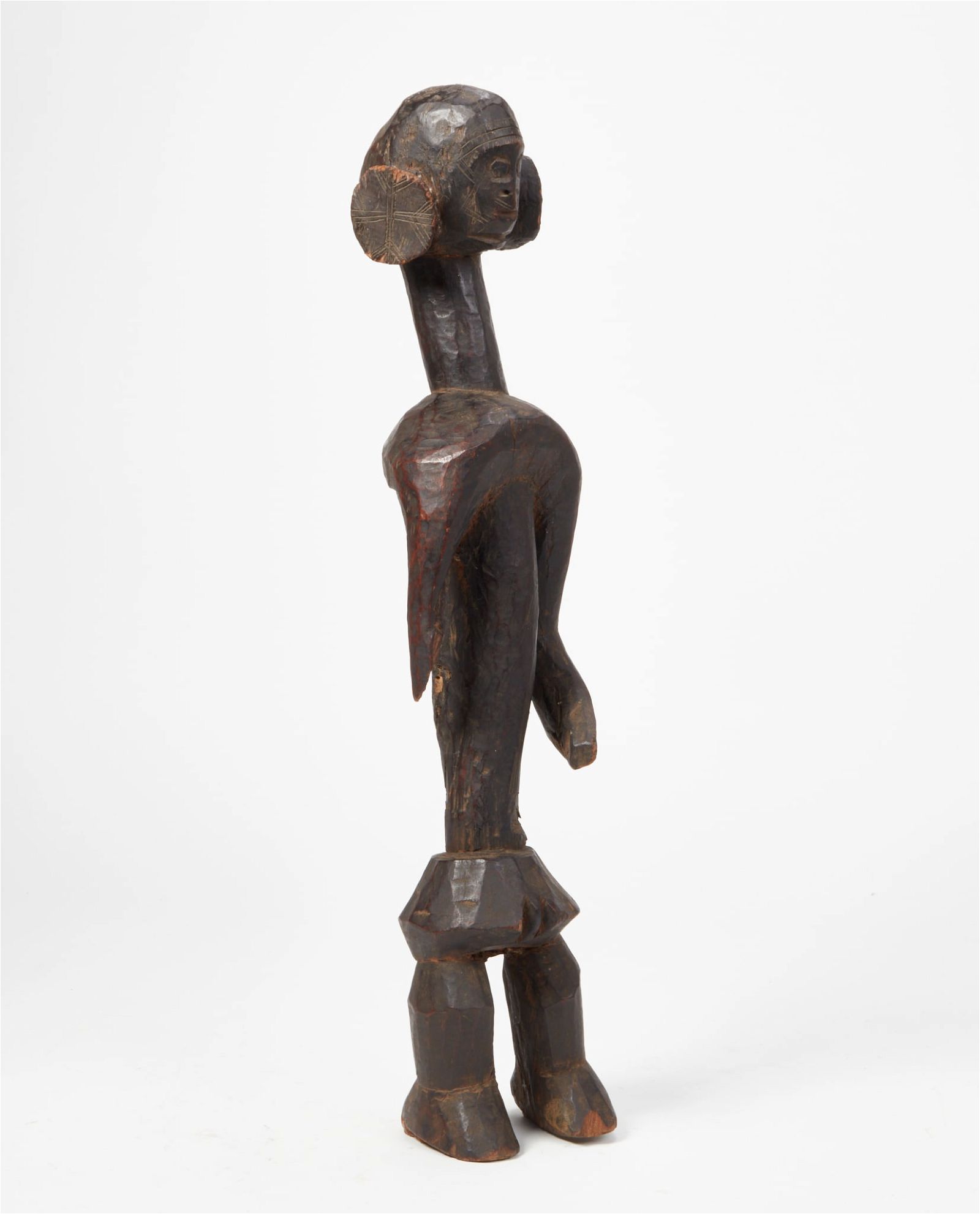 AN AFRICAN TRIBAL CARVED WOOD FIGURE,