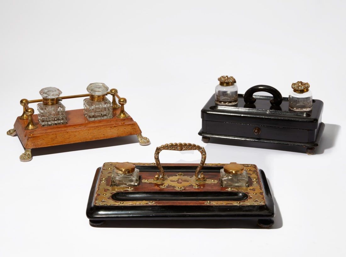 A GROUP OF THREE ENGLISH DESK STANDSA