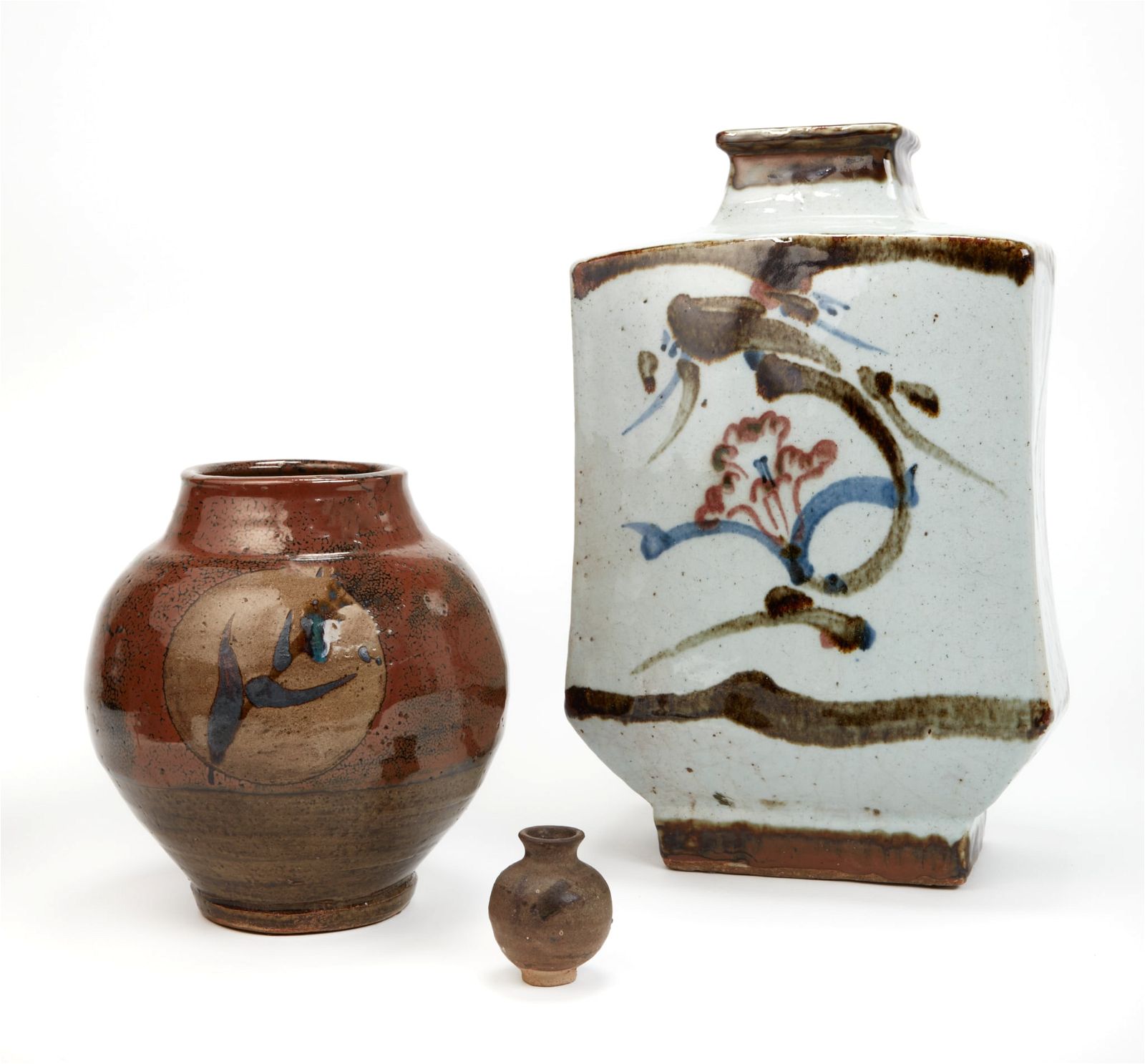 A GROUP OF THREE ASIAN CERAMIC