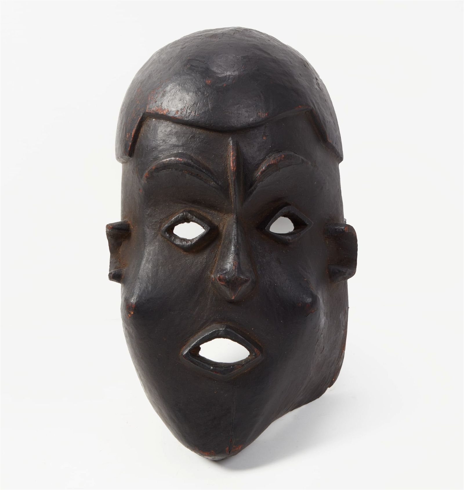 AN AFRICAN TRIBAL EBONIZED CARVED