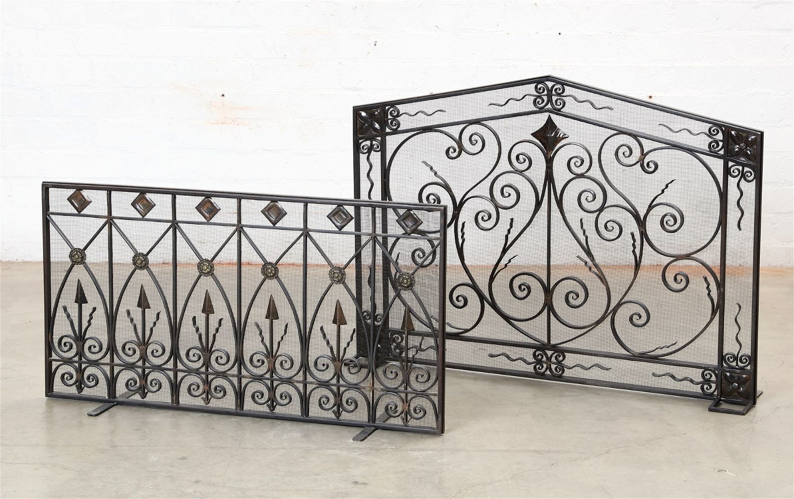TWO WROUGHT IRON FIRE SCREENSTwo