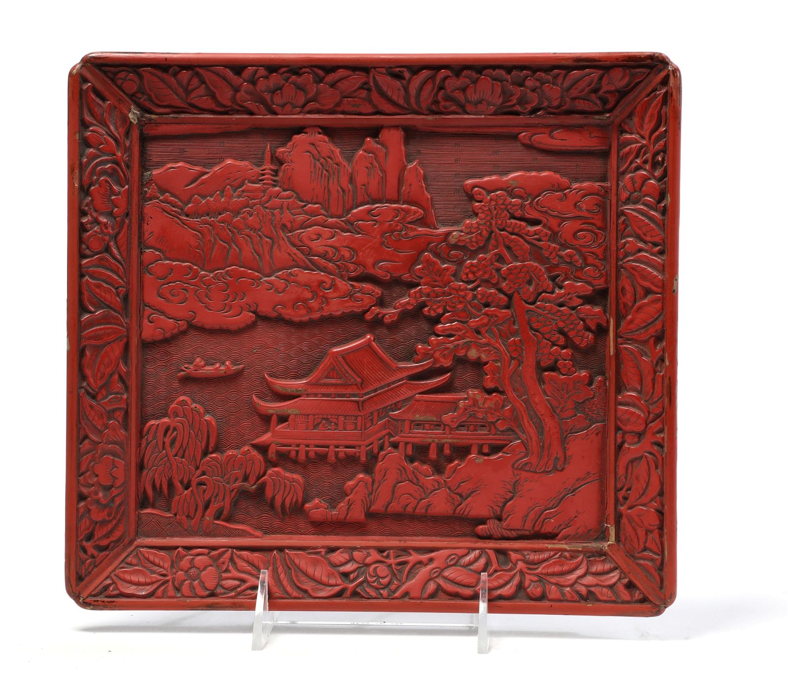 AN ASIAN CARVED RED LACQUER TRAYAn