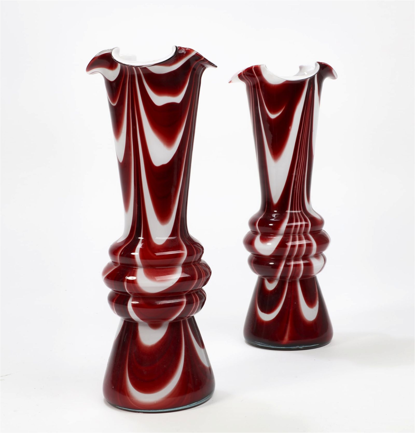 A PAIR OF RED AND WHITE SWIRL GLASS