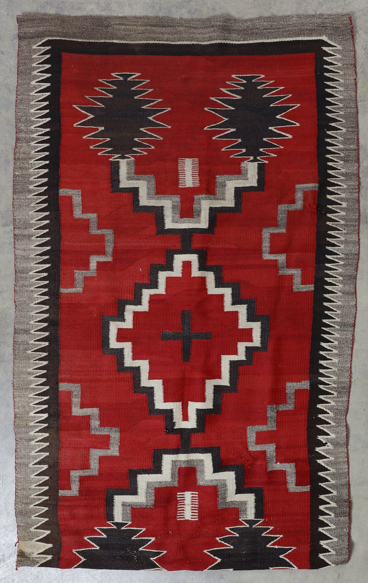 A NATIVE AMERICAN RUG, NAVAJOA Native