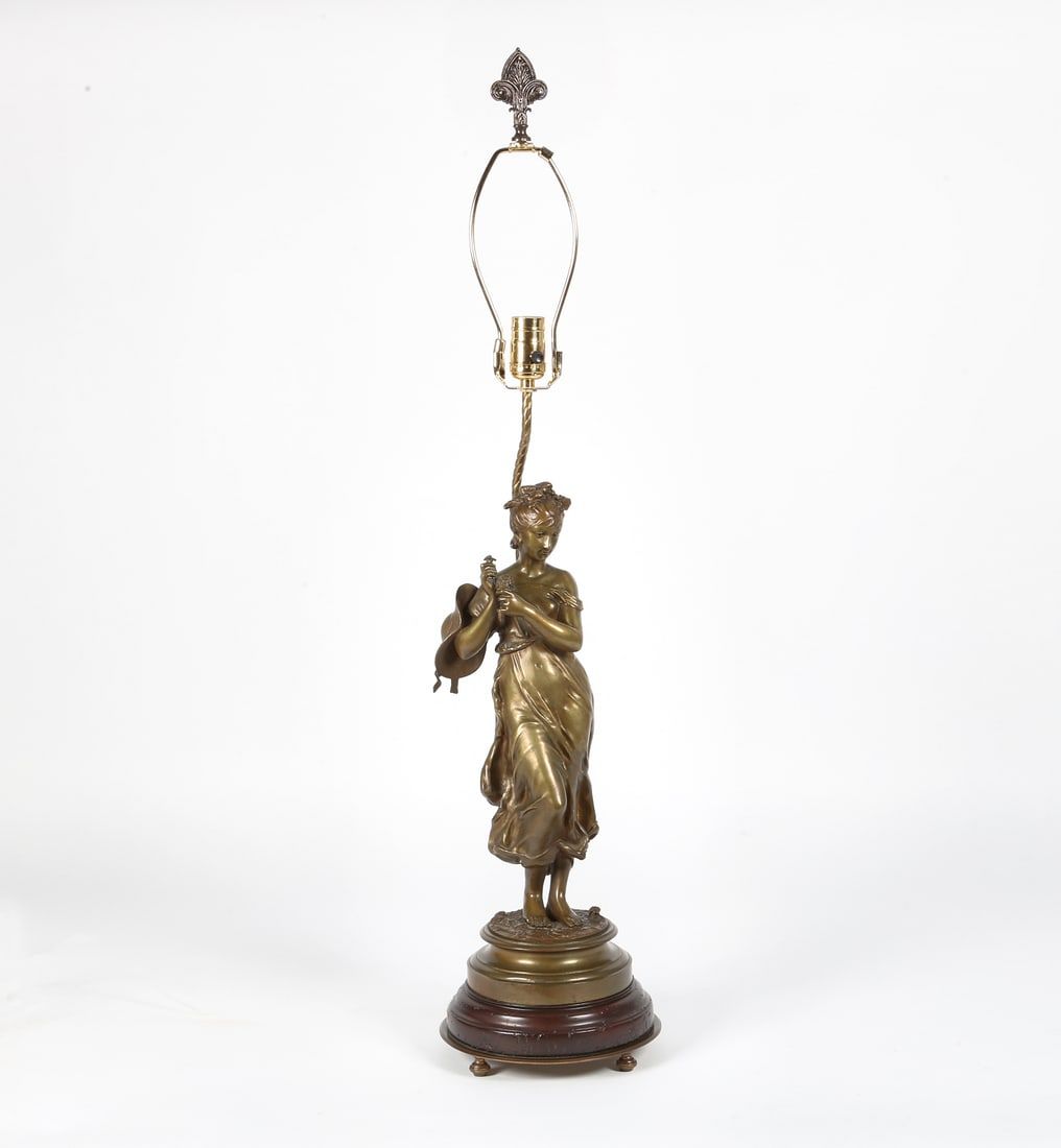 A FRENCH BRONZE MODEL OF A MAIDEN