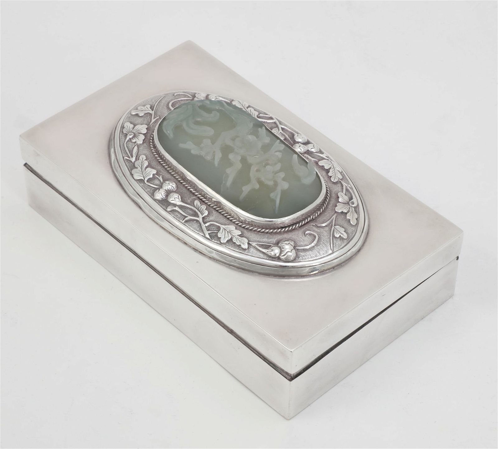 A CHINESE  JADE PLAQUE IN A SILVER