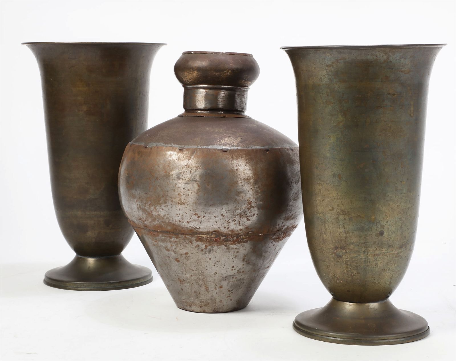 A GROUP OF THREE METALWARE URNSA