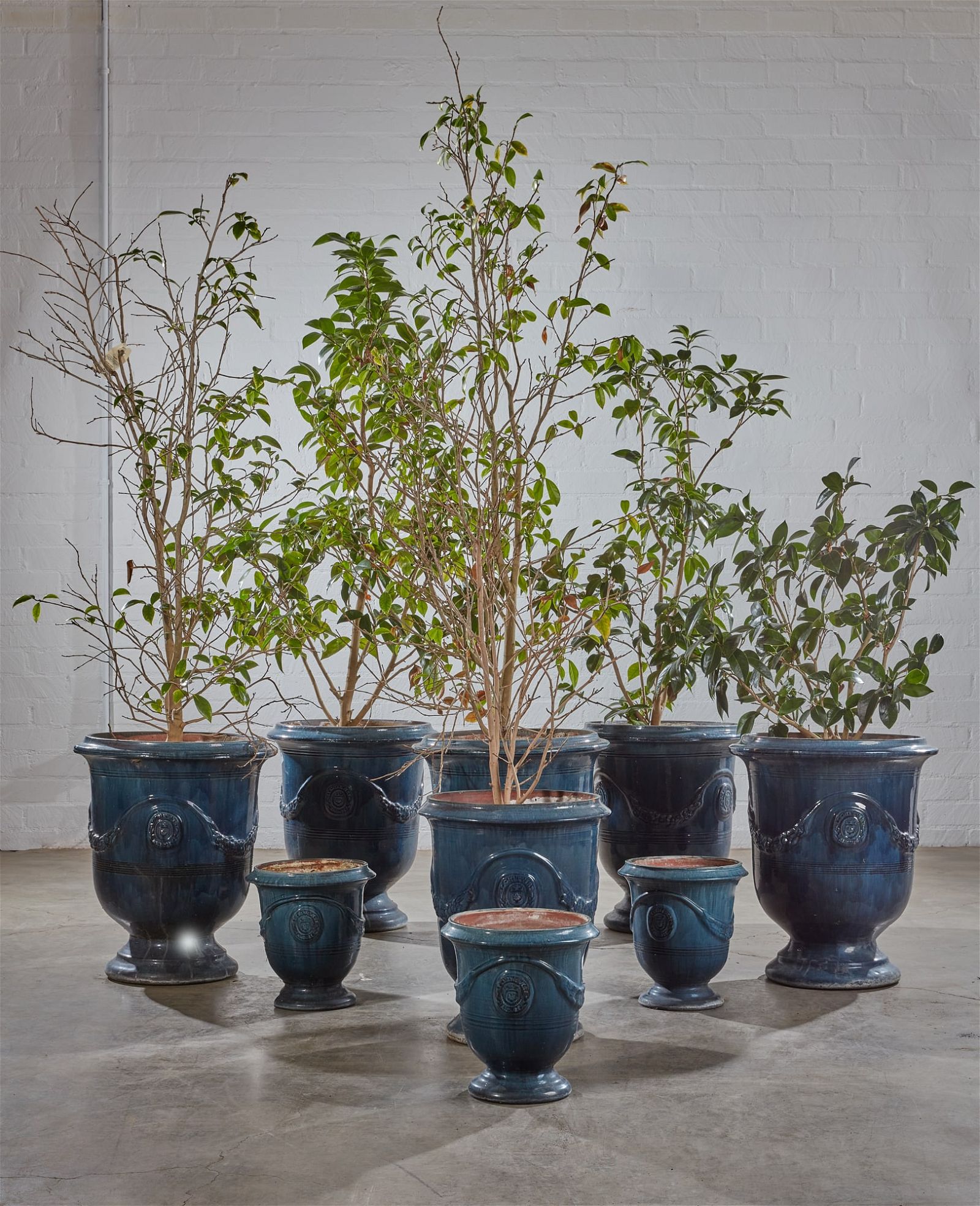 A GROUP OF NINE GLAZED EARTHENWARE