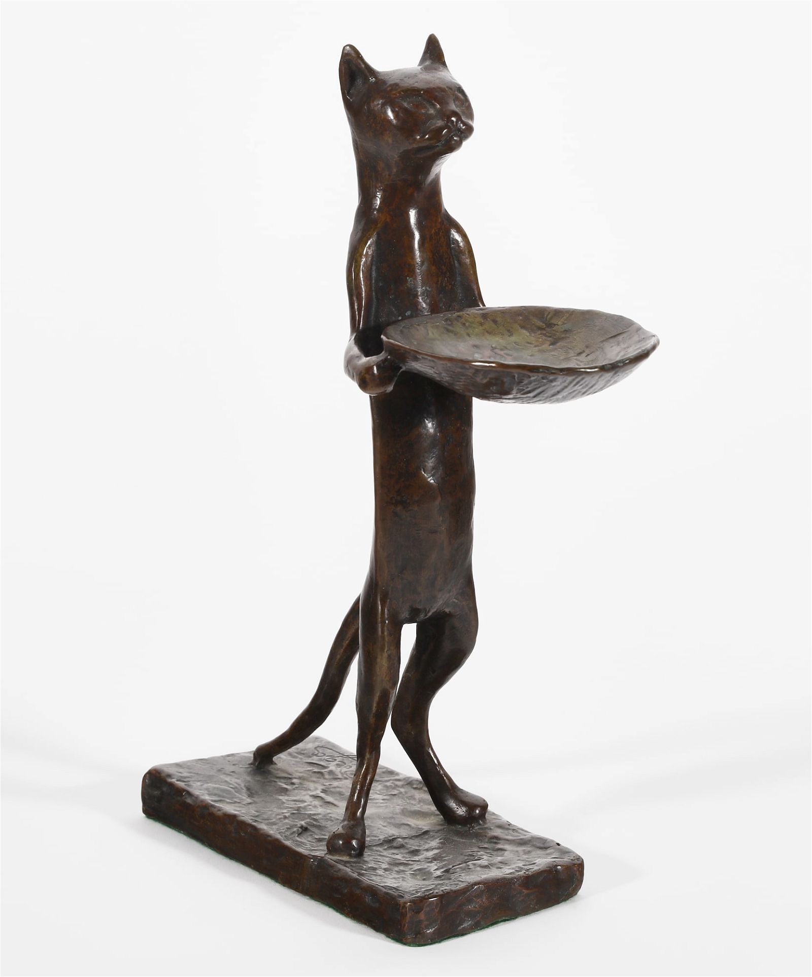 A PATINATED BRONZE FIGURE OF A
