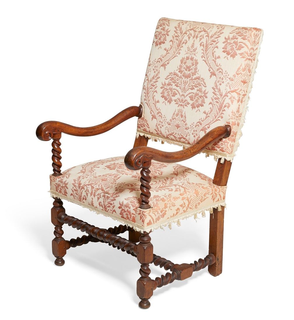 A CONTINENTAL BAROQUE STYLE WALNUT ARMCHAIRA