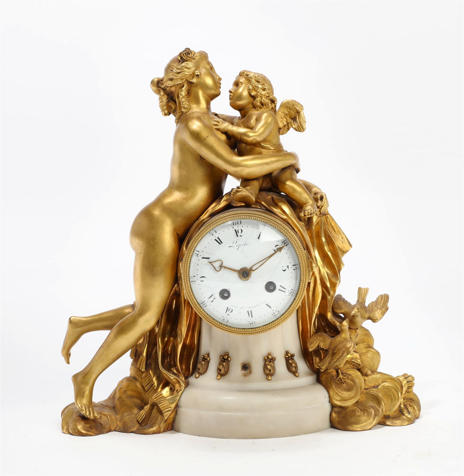 A FRENCH WHITE MARBLE FIGURAL CLOCK,A