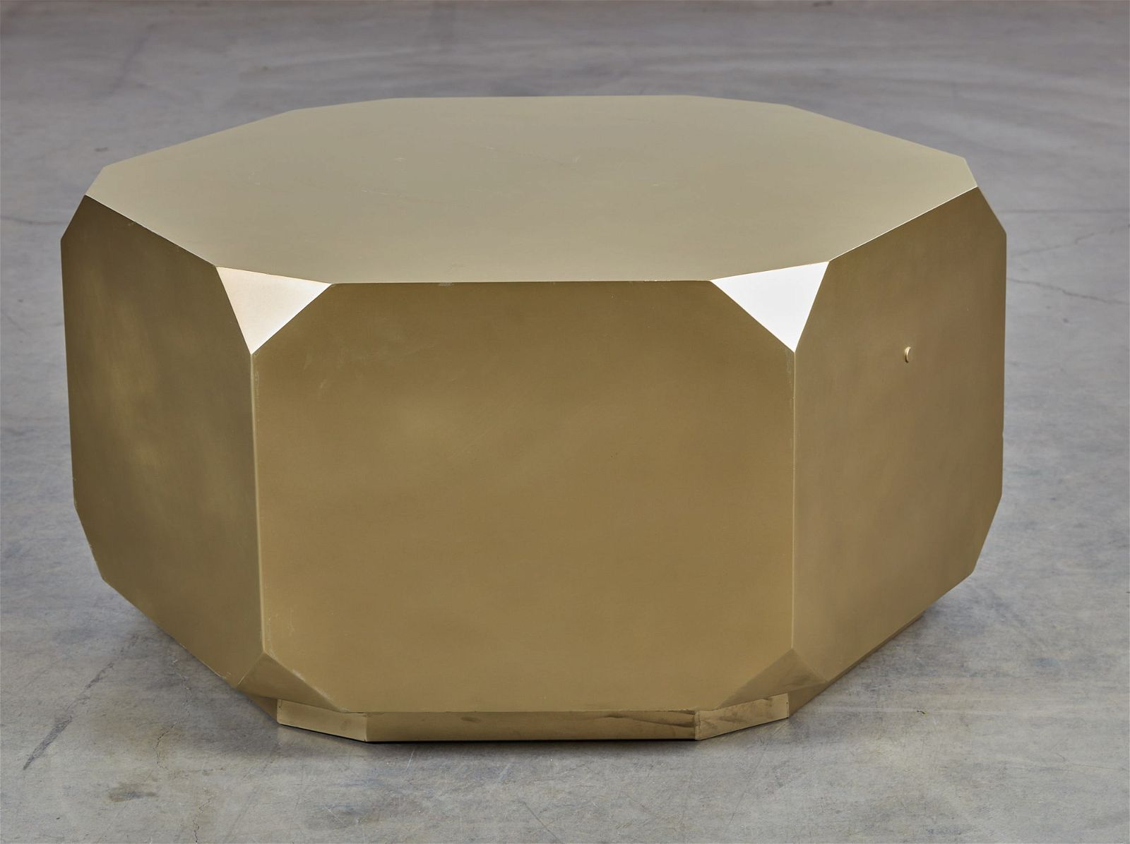 A CONTEMPORARY GOLD PAINTED METAL