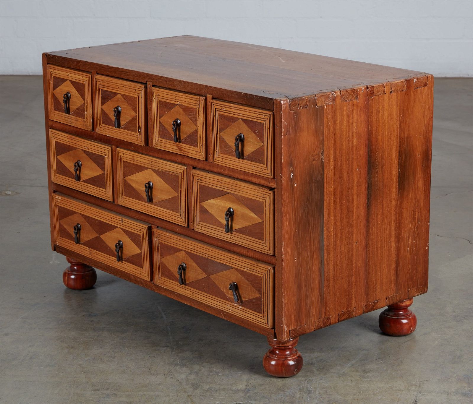 A CONTINENTAL WALNUT TABLE CABINETA