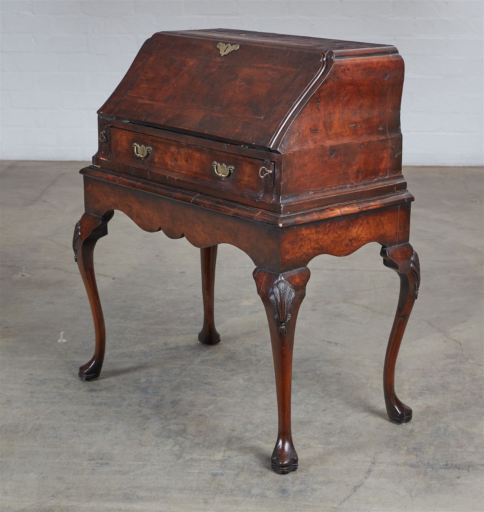 A GEORGE II STYLE WALNUT BUREAU