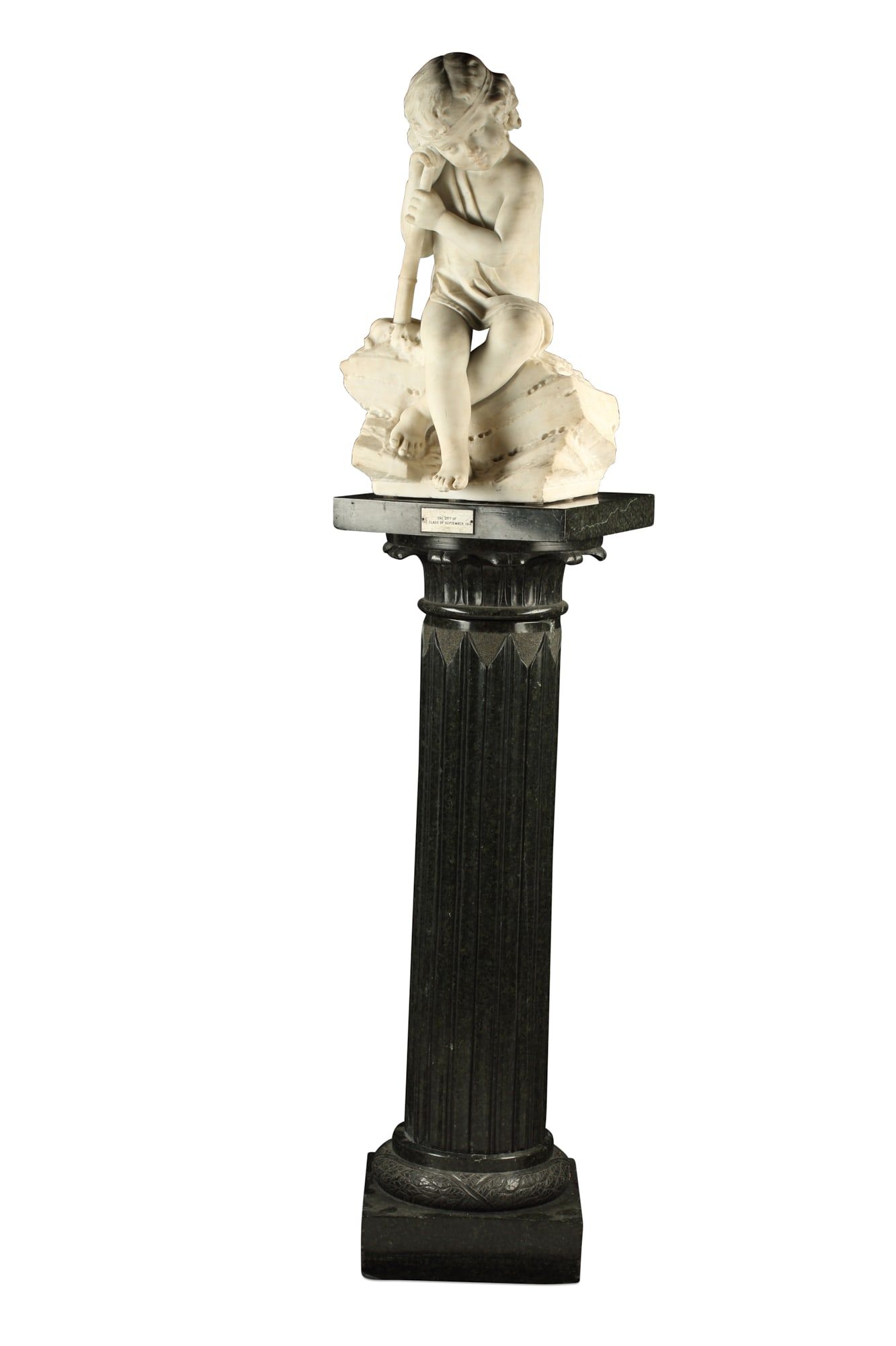 AN ITALIAN MARBLE PUTTO ON A PEDESTALAn