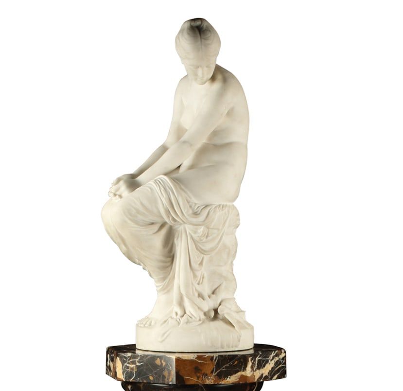 AN ITALIAN MARBLE FIGURE OF A MAIDEN,