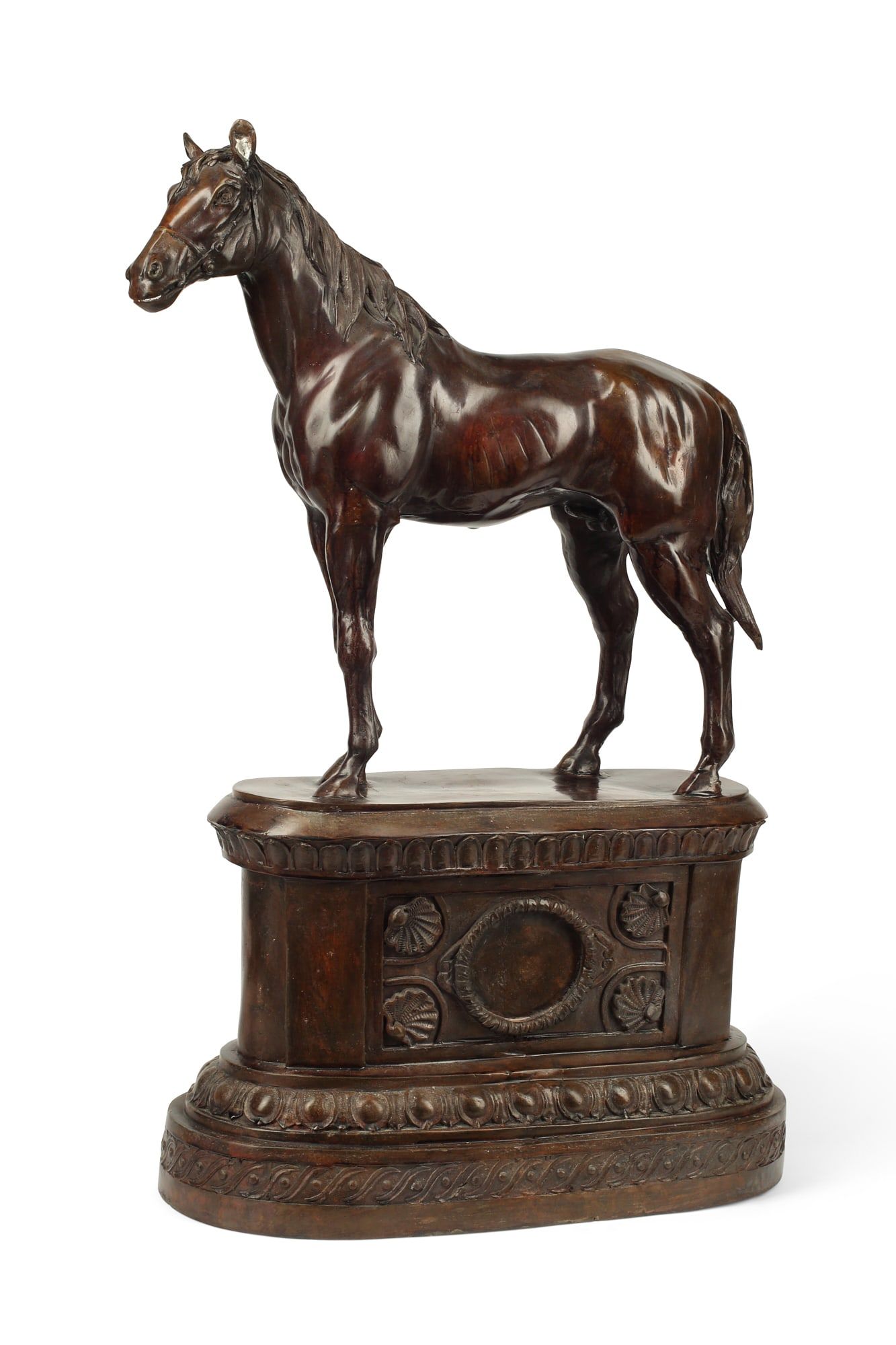 A  BRONZE MODEL OF A STANDING STALLIONA