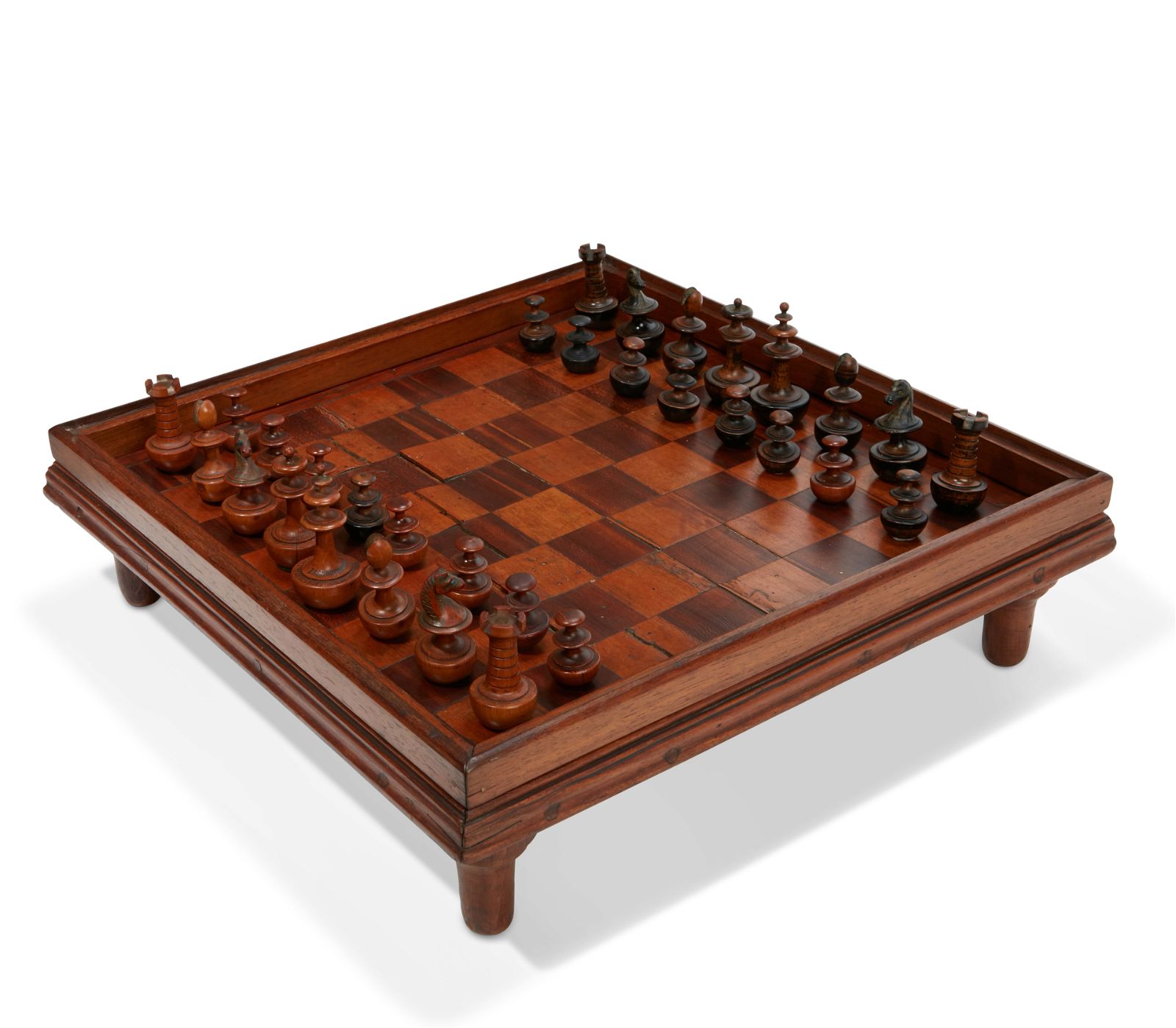 A GERMAN SELF RIGHTING CHESS SET,