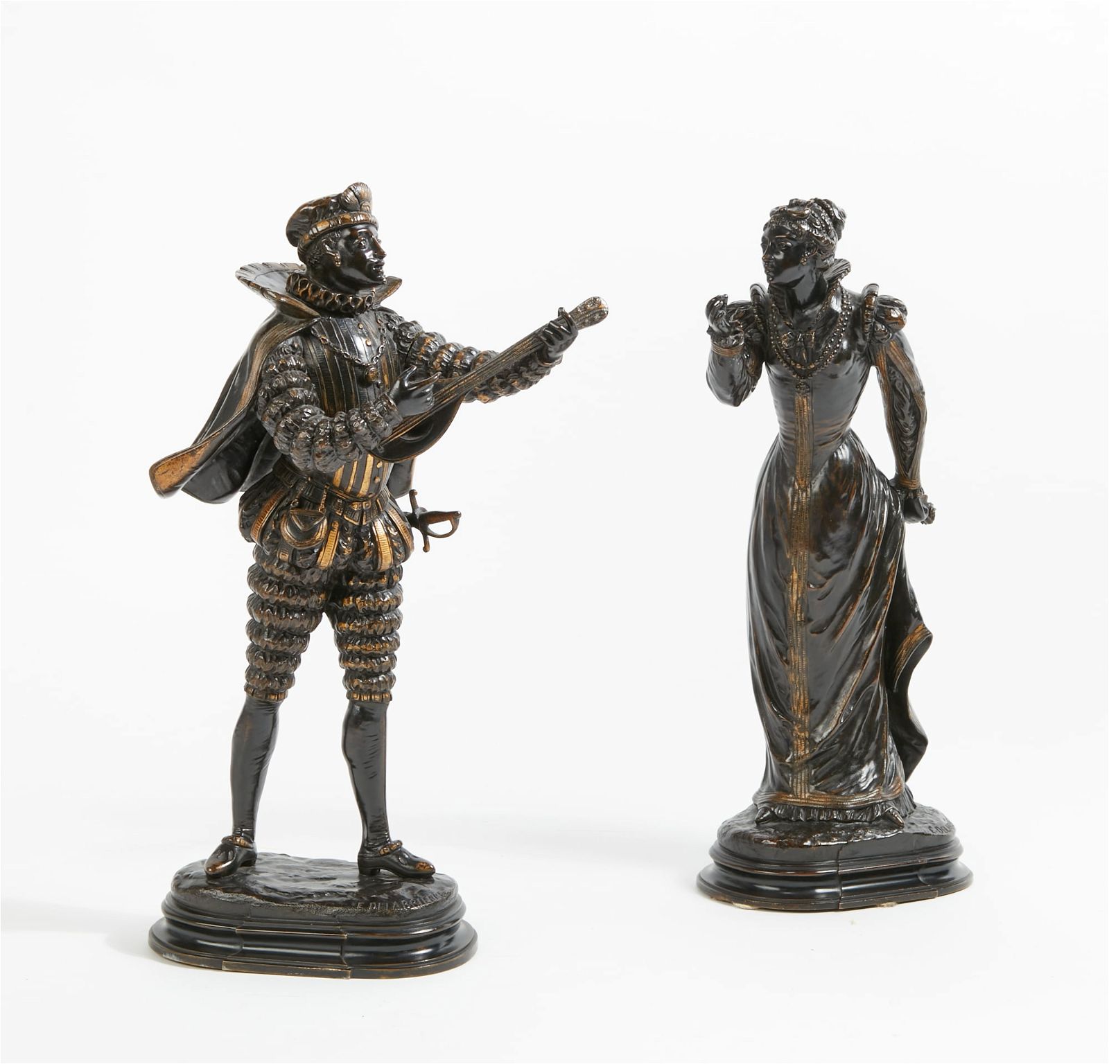 A PAIR OF FRENCH MODELS OF A MUSICIAN
