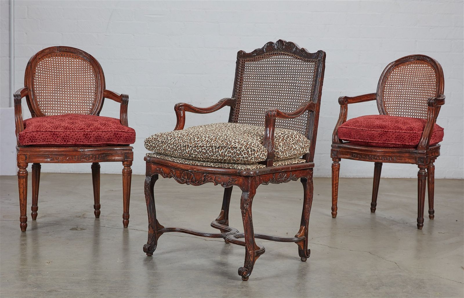 TWO LOUIS XVI FAUTEUILS AND A REGENCE